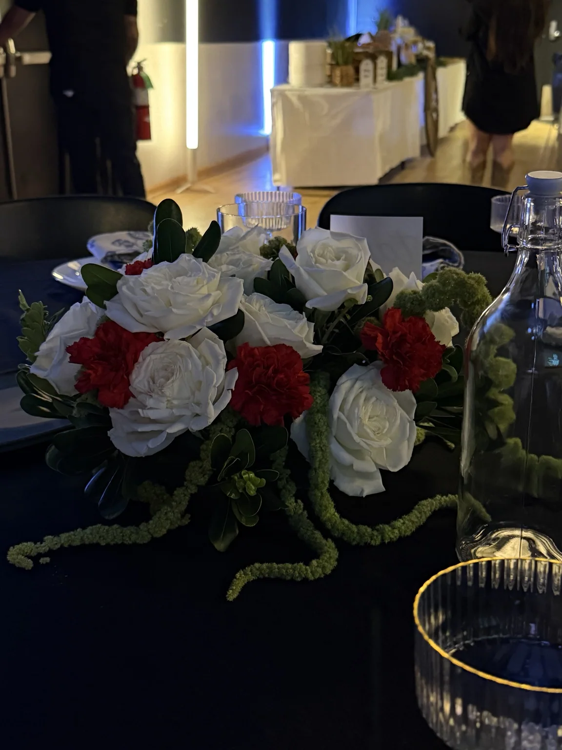 White and red roses centerpiece with hanging amaranthus