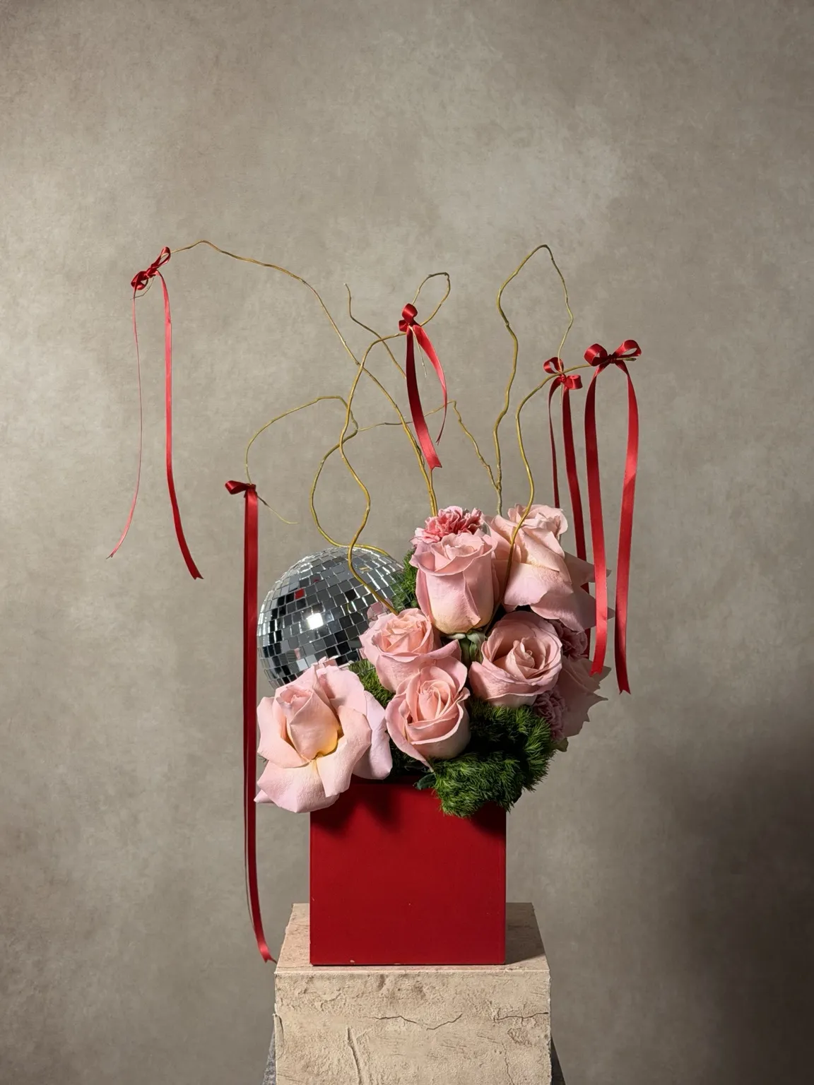 Back of the pink piece: pink roses in a red cube with willow, red ribbons and a mirror ball